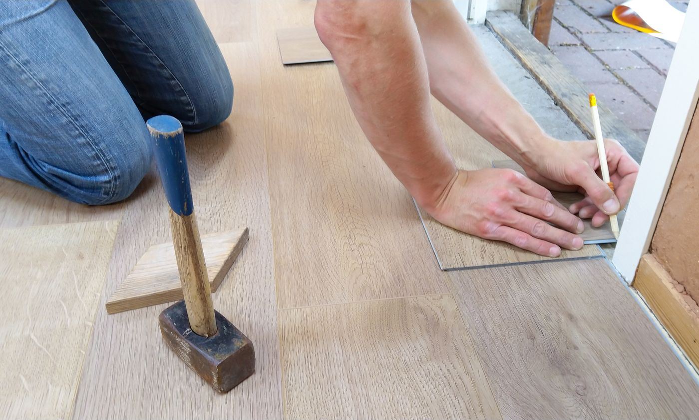 Installer measuring a floor